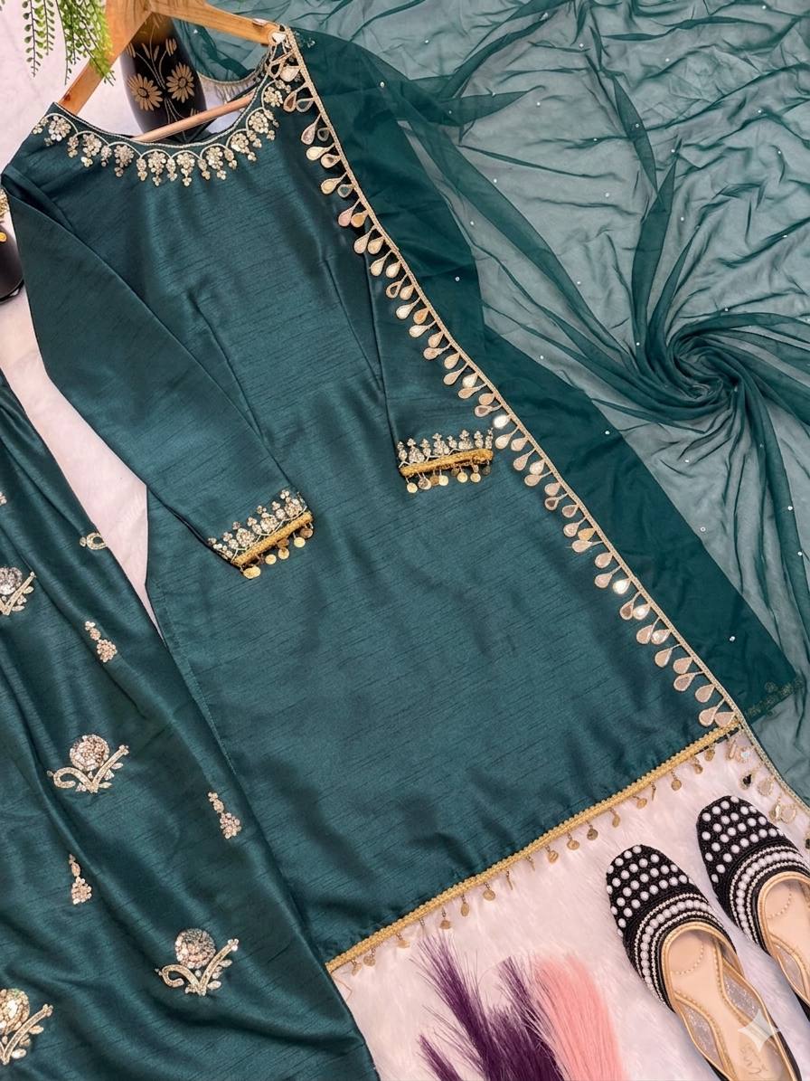 Majestic Emerald Green Kurta and Salwar Suit Set Featuring Intricate Gold Embroidery, Floral Motifs, and Ornate Coin Tassel Embellishments